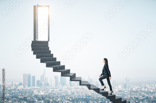 Businesswoman walking on ladder to success megapolis city view photo