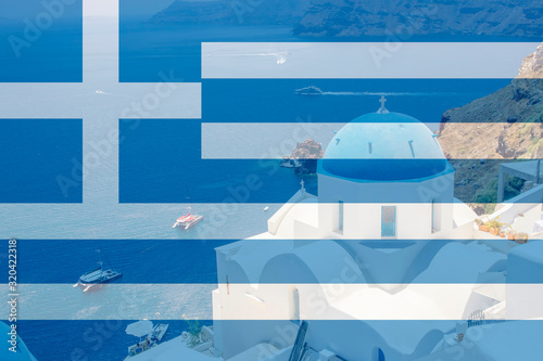 Greece as travel destination concept. Blue dome churches on Santorini island in village Oia, Greece. With transparent Greece flag. © FotoHelin