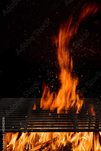 Empty flaming charcoal gril...