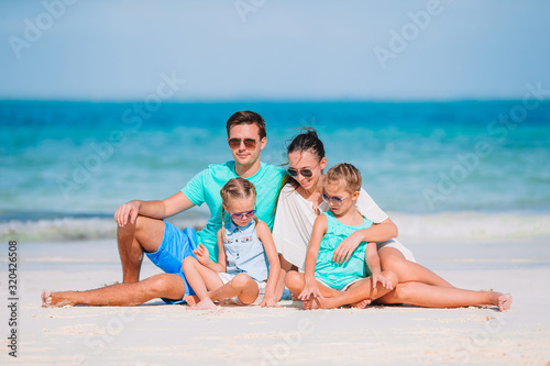 Young family on vacation on the beach © travnikovstudio