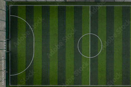 Striped soccer field background, Green grass soccer field background © volody10