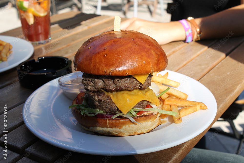 Burger double steak handmade bread and french fries and chips