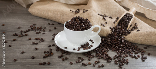 Roasted coffee beans in a coffee mug