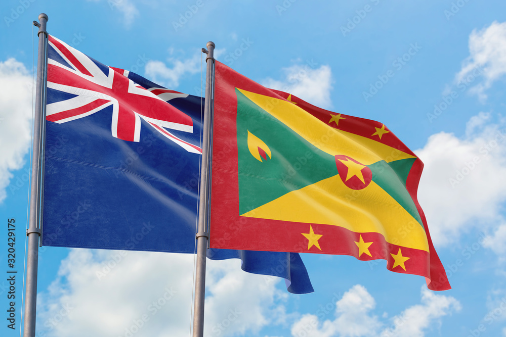 Grenada and Anguilla flags waving in the wind against white cloudy blue sky together. Diplomacy concept, international relations. Grenada and Anguilla flags waving in the wind against white cloudy blue sky together. Diplomacy concept, international relations.