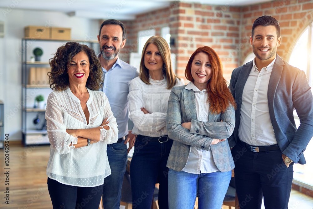 © Krakenimages.com - Group of business workers smiling happy and confident. Posing together with smile on face looking at the camera at the office © Krakenimages.com - Group of business workers smiling happy and confident. Posing together with smile on face looking at the camera at the office