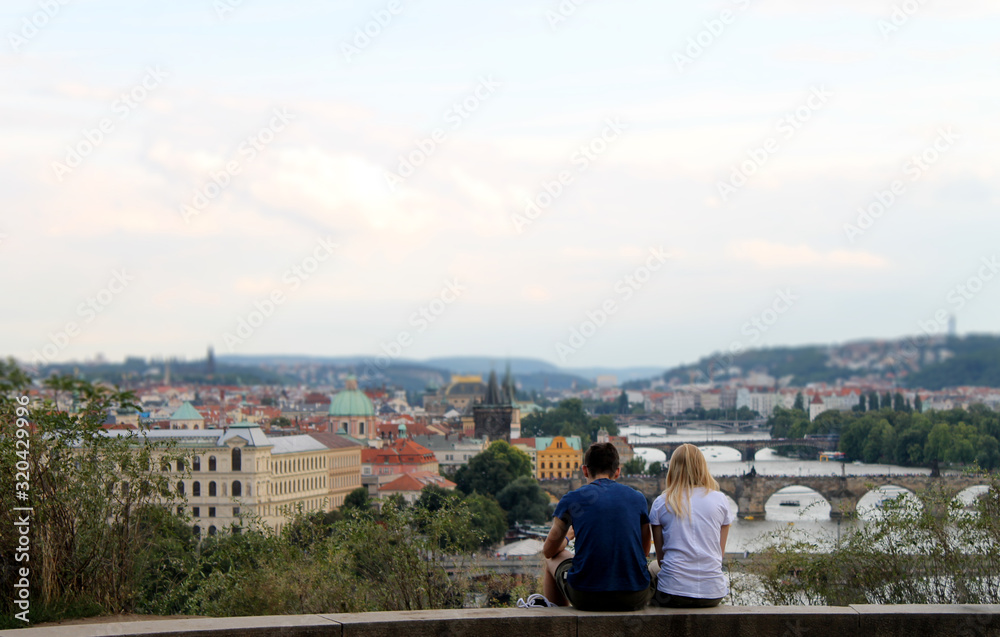 Couple with beautiful point of view on the city roof top
