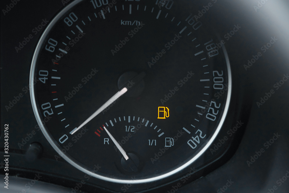 Empty fuel gauge warning light in car dashboard Empty fuel gauge warning light in car dashboard