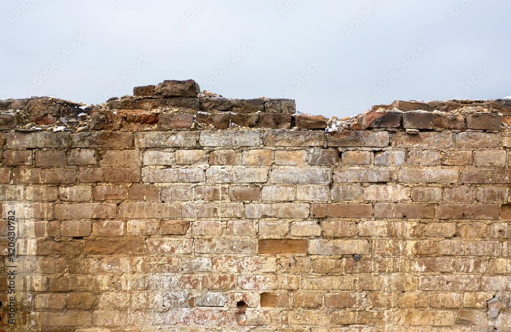 Fragment of wall in ruins of old manor. Element for design. Antique background.