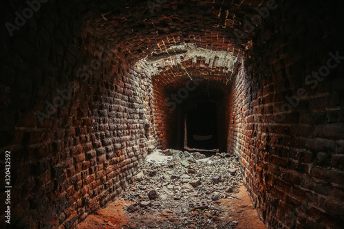 Historical underground red brick passage.
