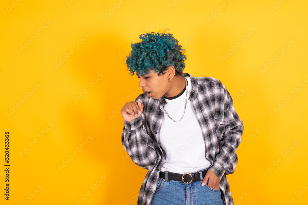 young afro american girl isolated on yellow background coughing young afro american girl isolated on yellow background coughing