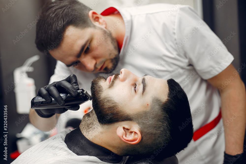 Man with a beard. Hairdresser with a client. Man with a beard. Hairdresser with a client.