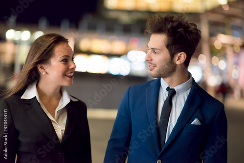 Business people walking at night