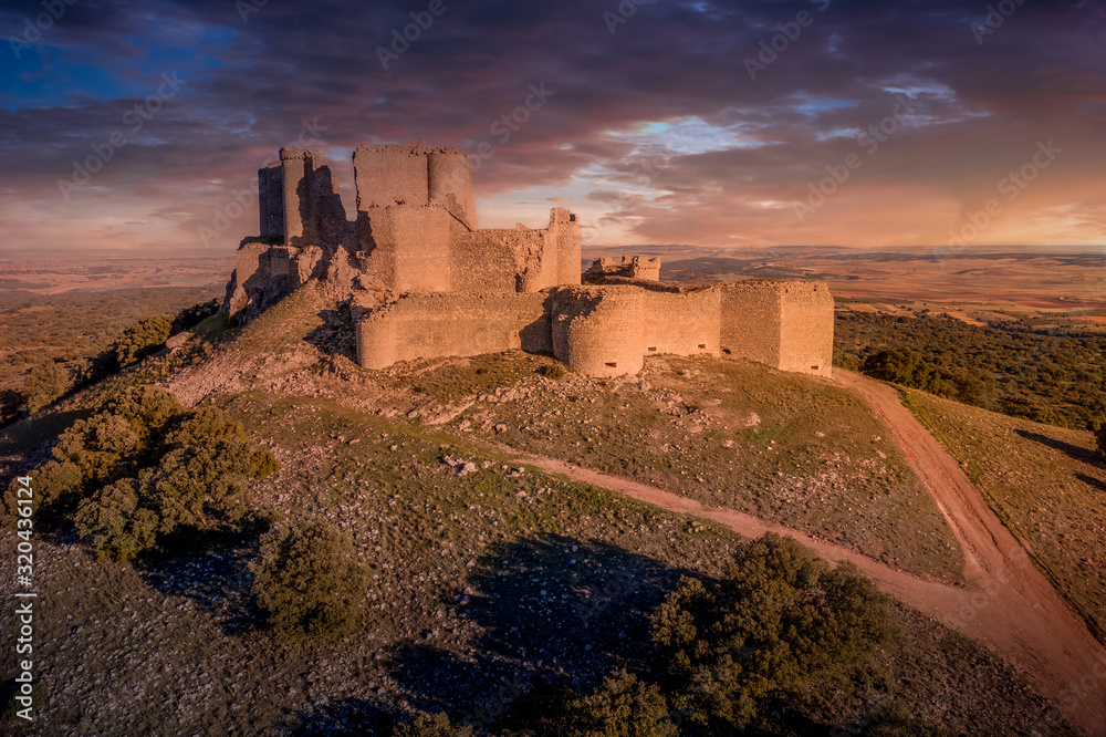 Aerial view of medieval castle ruin Pueble de Almenara in Cuenca Spain with convenctric walls, semicircular towers and angle bastions