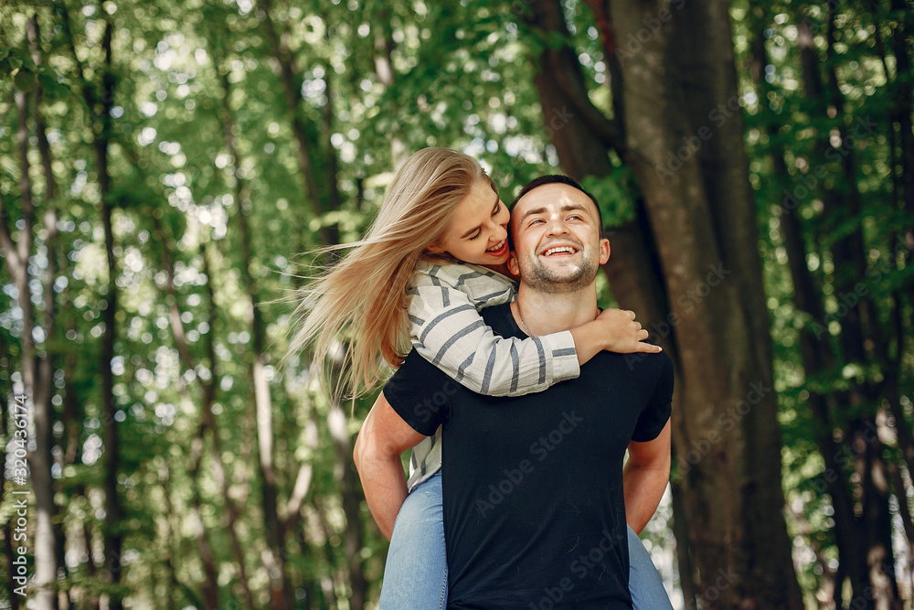Couple in a forest, warm summer, lovely weather Couple in a forest, warm summer, lovely weather