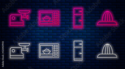 Set line Microwave oven, Refrigerator, Kitchen meat grinder and Citrus fruit juicer. Glowing neon icon on brick wall. Vector
