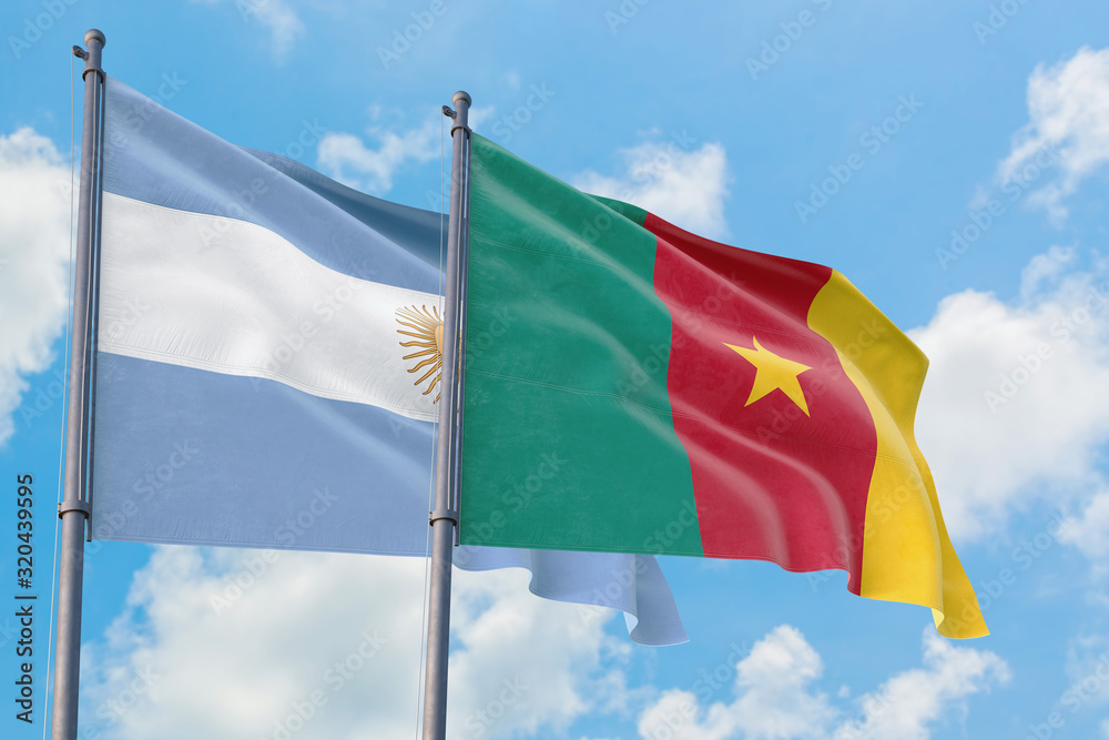 Cameroon and Argentina flags waving in the wind against white cloudy blue sky together. Diplomacy concept, international relations. Cameroon and Argentina flags waving in the wind against white cloudy blue sky together. Diplomacy concept, international relations.