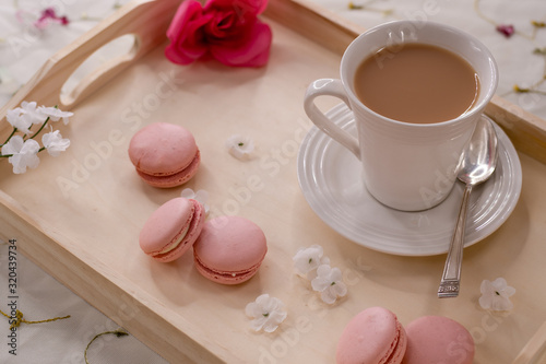 White Tea Cup on a Serving Tray with Pink Flowers and Cookies