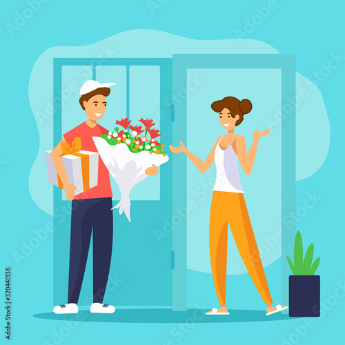 Smiling delivery man is handing flowers bouquet and gift box to a girl at her home.