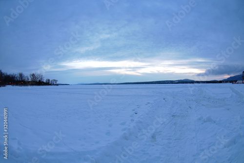 frozen lake winter landscape ice and snow dusk © Jacques Durocher