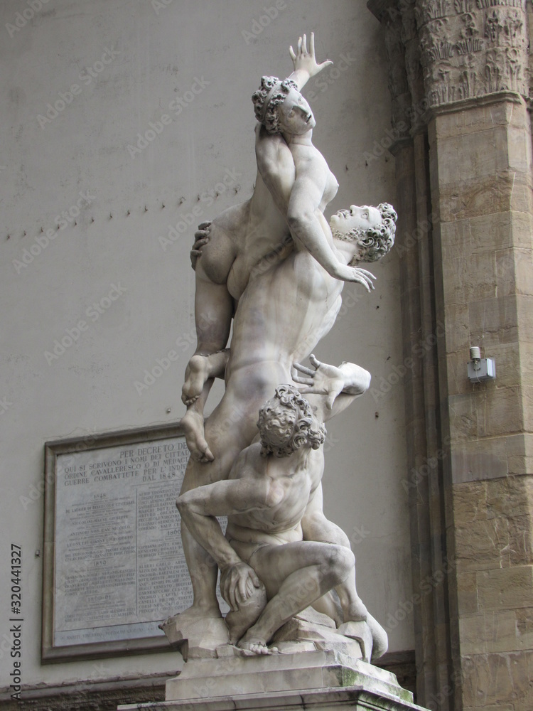 View of the Rape of the Sabine Women statue located in the Loggia dei Lanzi, on the Piazza della Signoria in Florence, Italy