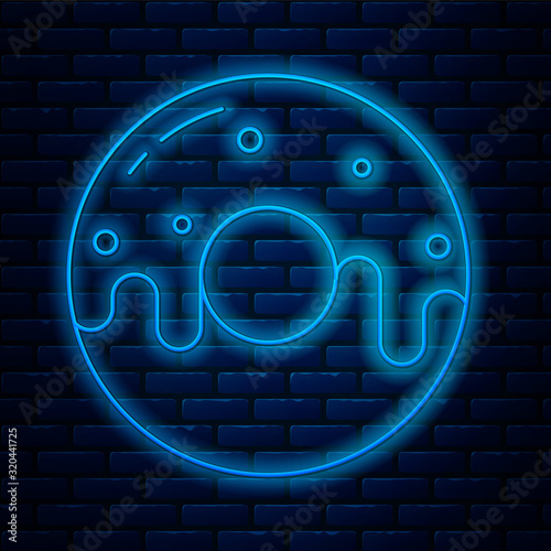 Glowing neon line Donut with sweet glaze icon isolated on brick wall background. Vector Illustration