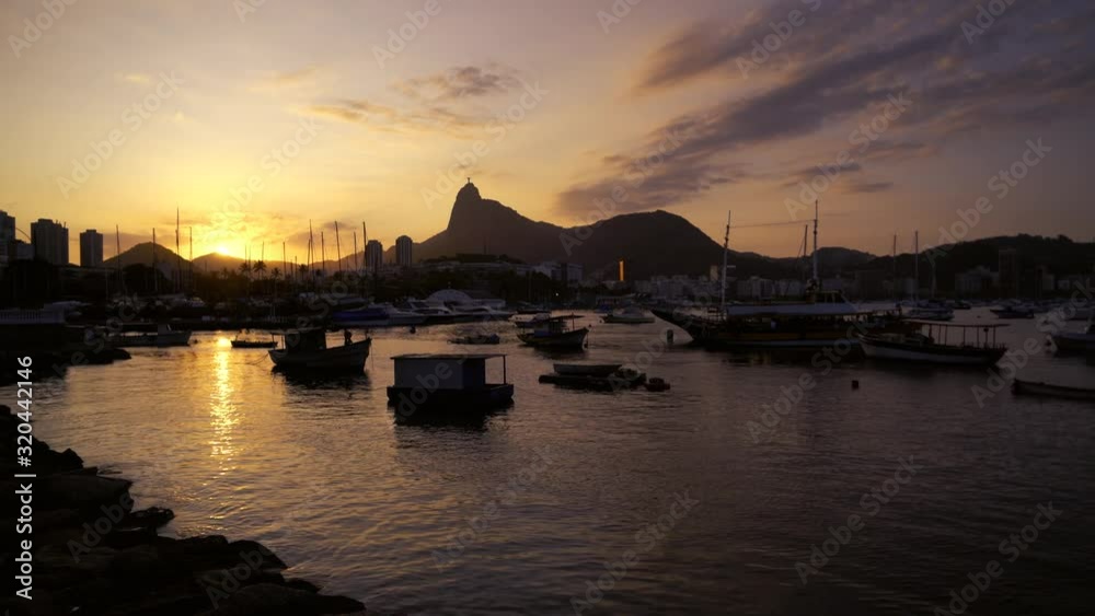 Beautiful golden hour sunset in Rio de Janeiro, with it's Christ the Redeemer statue Beautiful golden hour sunset in Rio de Janeiro, with it's Christ the Redeemer statue