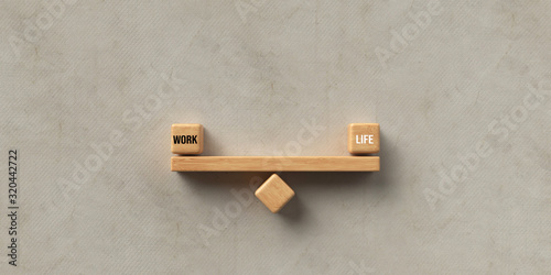 Plakat wooden blocks formed as a seesaw with the words WORK and LIFE on concrete background