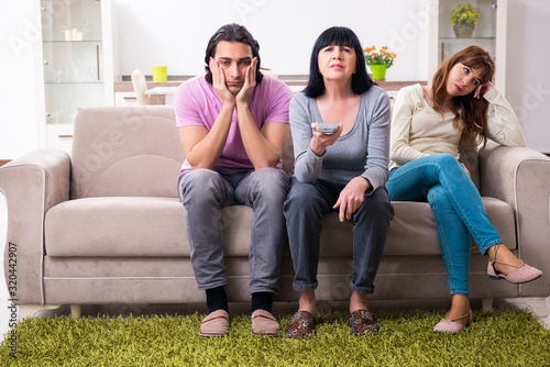 Canvas Print Young family and mother-in-law in family issues concept