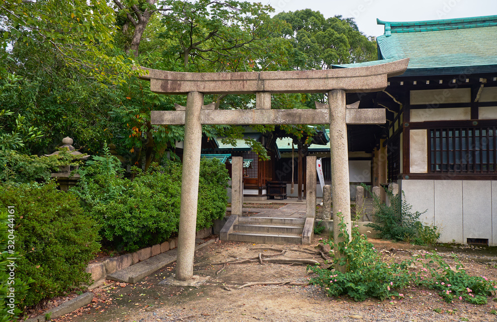 The torii gate to the Shiratama Shrine. Osaka Castle. Osaka. Japan