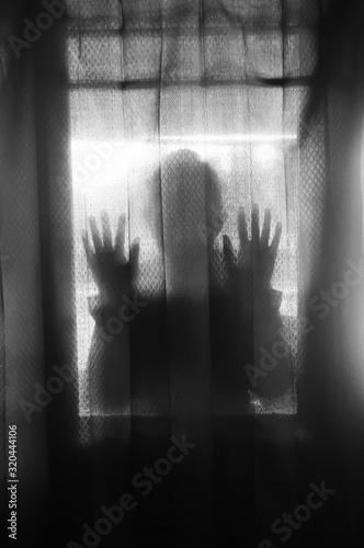 the mysterious silhouette of a woman as an atmosphere of horror