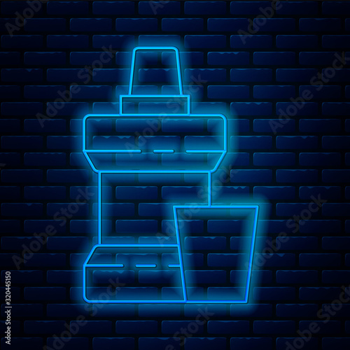 Glowing neon line Mouthwash plastic bottle and glass icon isolated on brick wall background. Liquid for rinsing mouth. Oralcare equipment. Vector Illustration