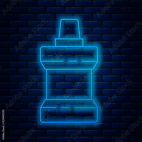 Glowing neon line Mouthwash plastic bottle icon isolated on brick wall background. Liquid for rinsing mouth. Oralcare equipment. Vector Illustration