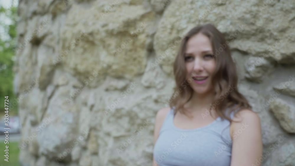Young beautiful girl is dancing in flowing skirt in old city slow motion Young beautiful girl is dancing in flowing skirt in old city slow motion