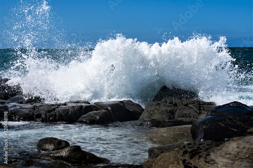 Waves crashing on the rocks on the beautiful Sunshine Coast in Queensland Australia.