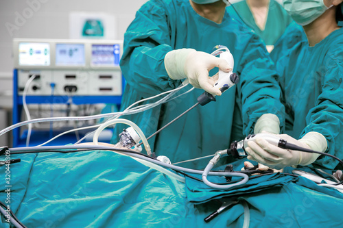 Surgeons team hands during laparoscopic abdominal operation in patient surgery in operating room