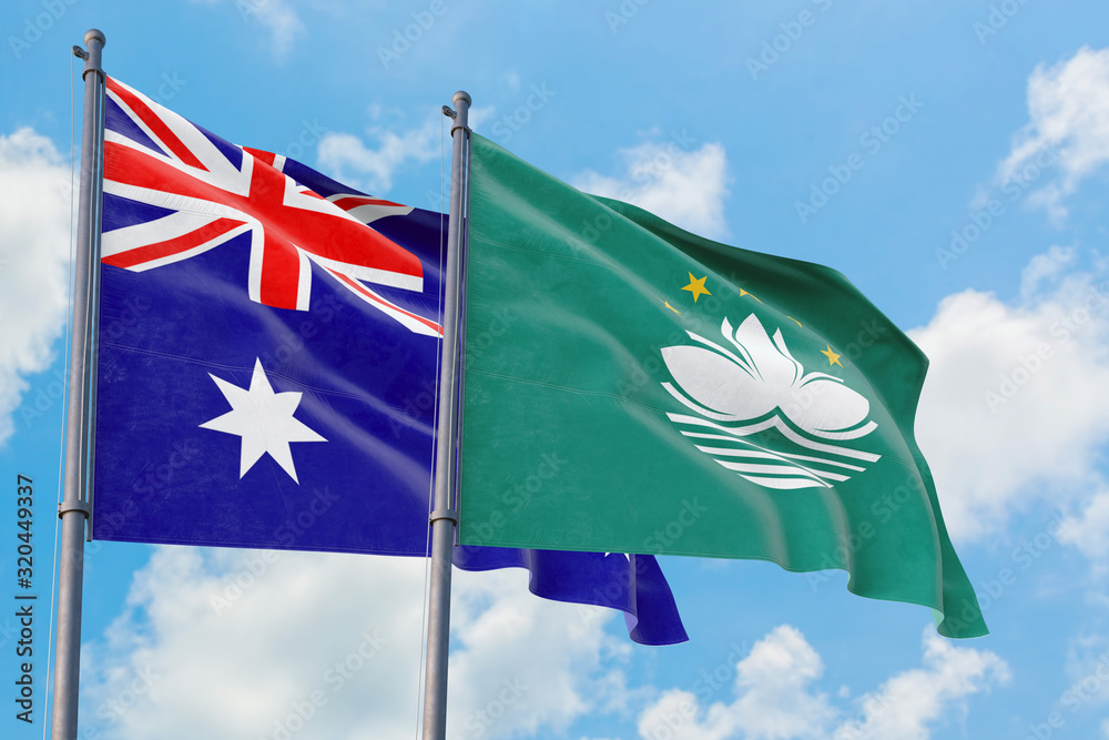 Macao and Australia flags waving in the wind against white cloudy blue sky together. Diplomacy concept, international relations. Macao and Australia flags waving in the wind against white cloudy blue sky together. Diplomacy concept, international relations.