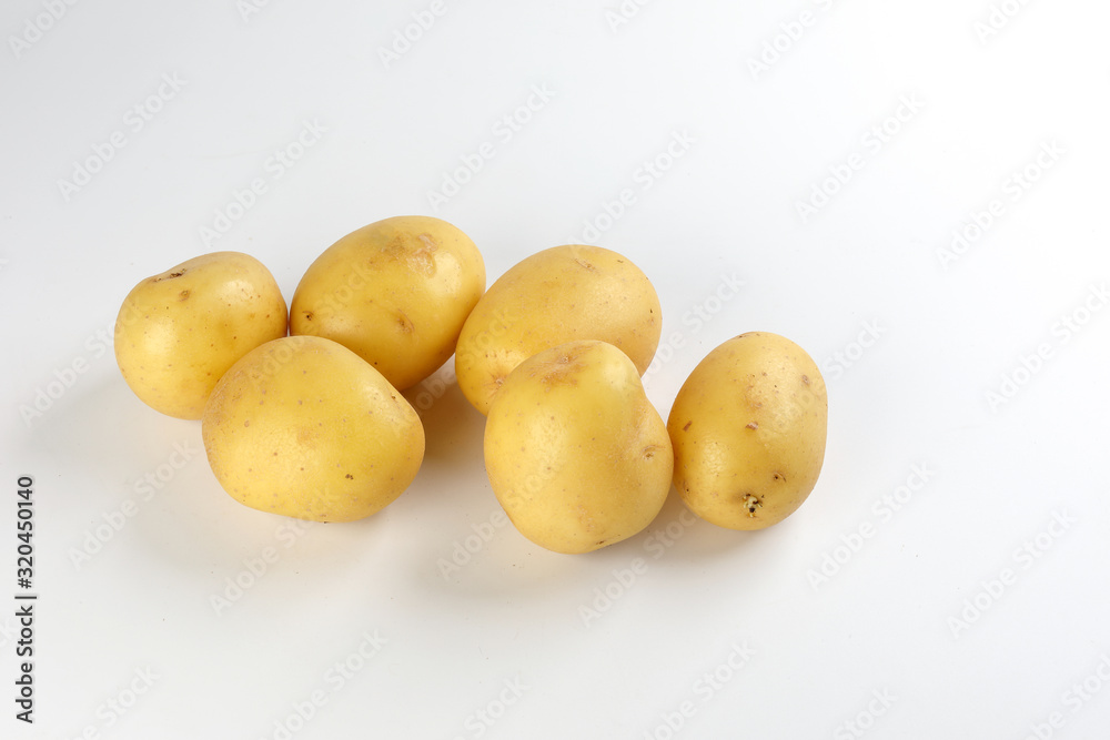 Yellow color small baby potato on white background Yellow color small baby potato on white background