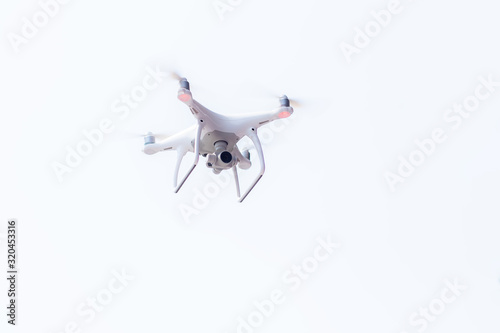 Air Drone Dron Flying with action camera. Isolated on White Background. photo