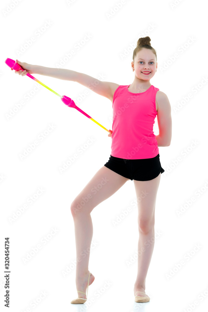 A girl gymnast performs exercises with a mace. A girl gymnast performs exercises with a mace.