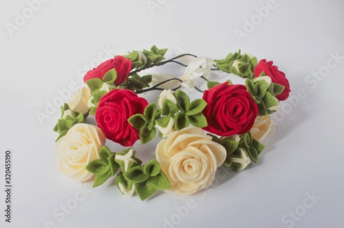 Beautiful Handmade Felt Floral Crown or tiara with Rose flowers and Green leaves for wedding event or feminine decorative element © Artflorara