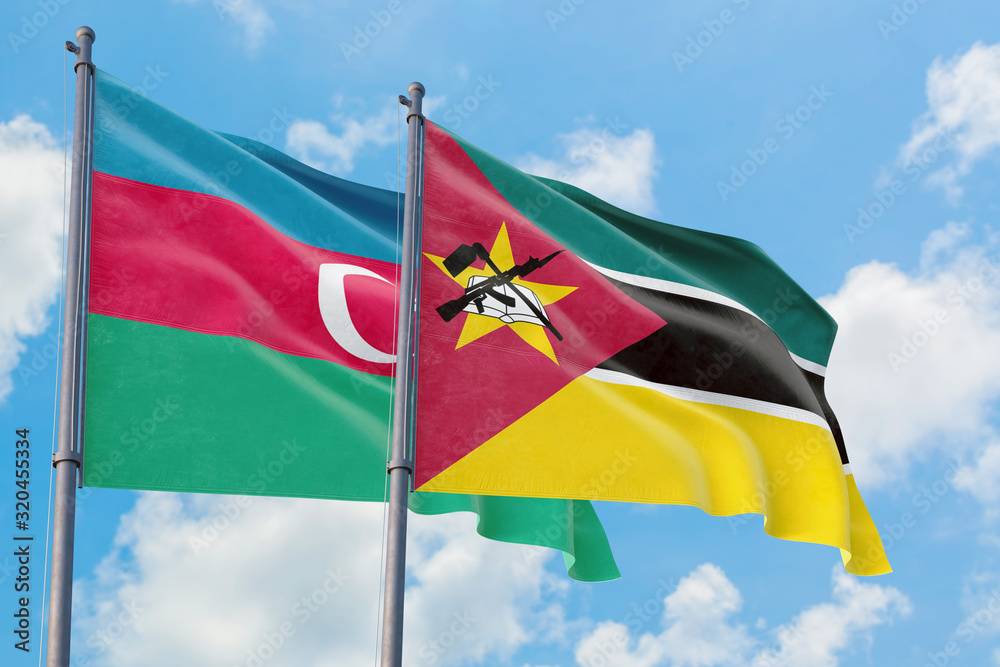 Mozambique and Azerbaijan flags waving in the wind against white cloudy blue sky together. Diplomacy concept, international relations. Mozambique and Azerbaijan flags waving in the wind against white cloudy blue sky together. Diplomacy concept, international relations.