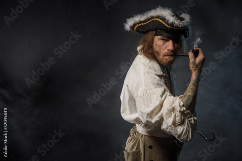 Bilde på lerret Portrait of pirate filibuster sea robber in suit with guns