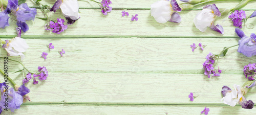spring flowers on old green wooden background