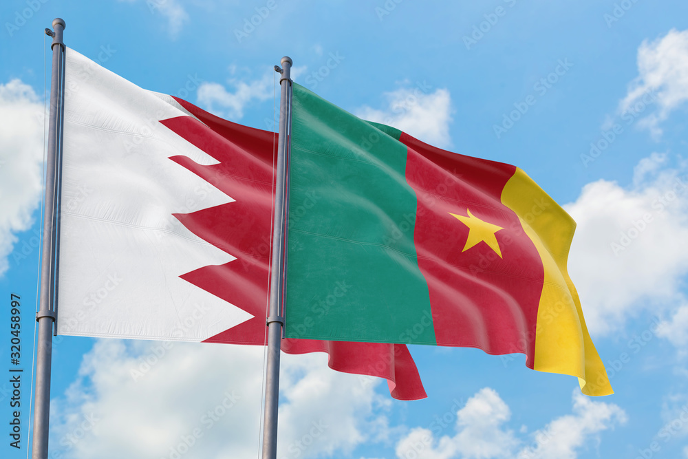 Cameroon and Bahrain flags waving in the wind against white cloudy blue sky together. Diplomacy concept, international relations. Cameroon and Bahrain flags waving in the wind against white cloudy blue sky together. Diplomacy concept, international relations.