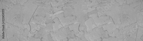 Concrete mortar strokes widescreen texture. Grey wet cement long background