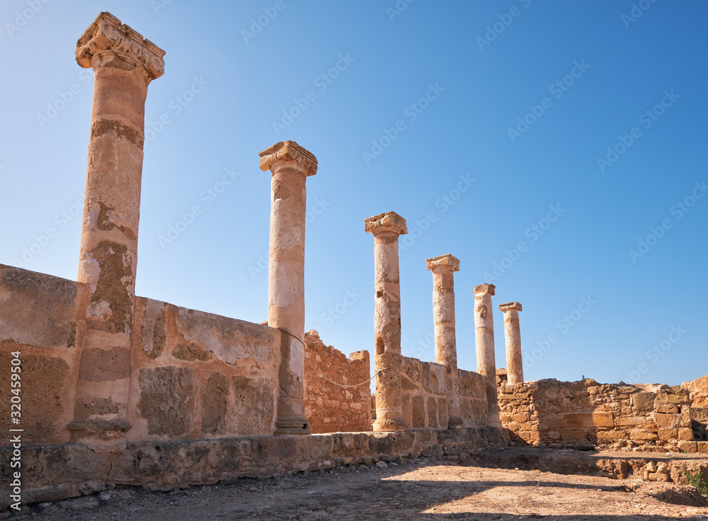 Сolonnade of ionic pillars of House of Theseus. Paphos Archaeological Park. Cyprus