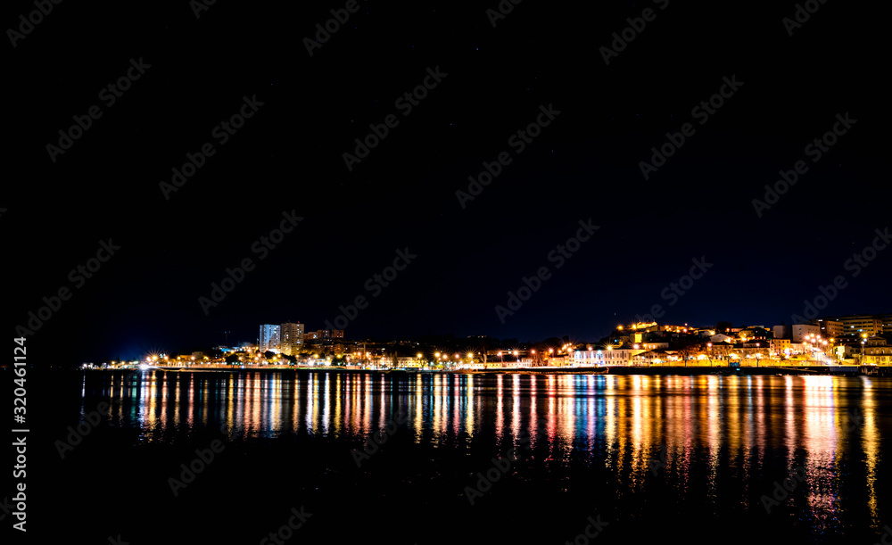 Panorama ofPorto city at night, reflection of shadows in water Panorama ofPorto city at night, reflection of shadows in water