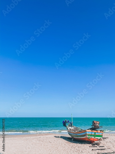 Beautiful view fishing boat on the beach tropical island seascape backgrounds