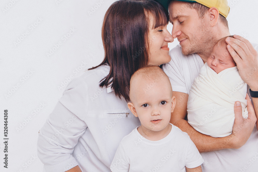 the concept of a healthy lifestyle, the protection of children, shopping - baby in the arms of the mother and wather. Woman and man holding a child the concept of a healthy lifestyle, the protection of children, shopping - baby in the arms of the mother and wather. Woman and man holding a child