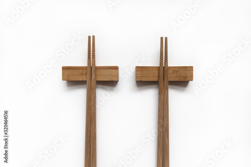 Wooden pairs of chopsticks on white background. cooking culture in Asian countries.